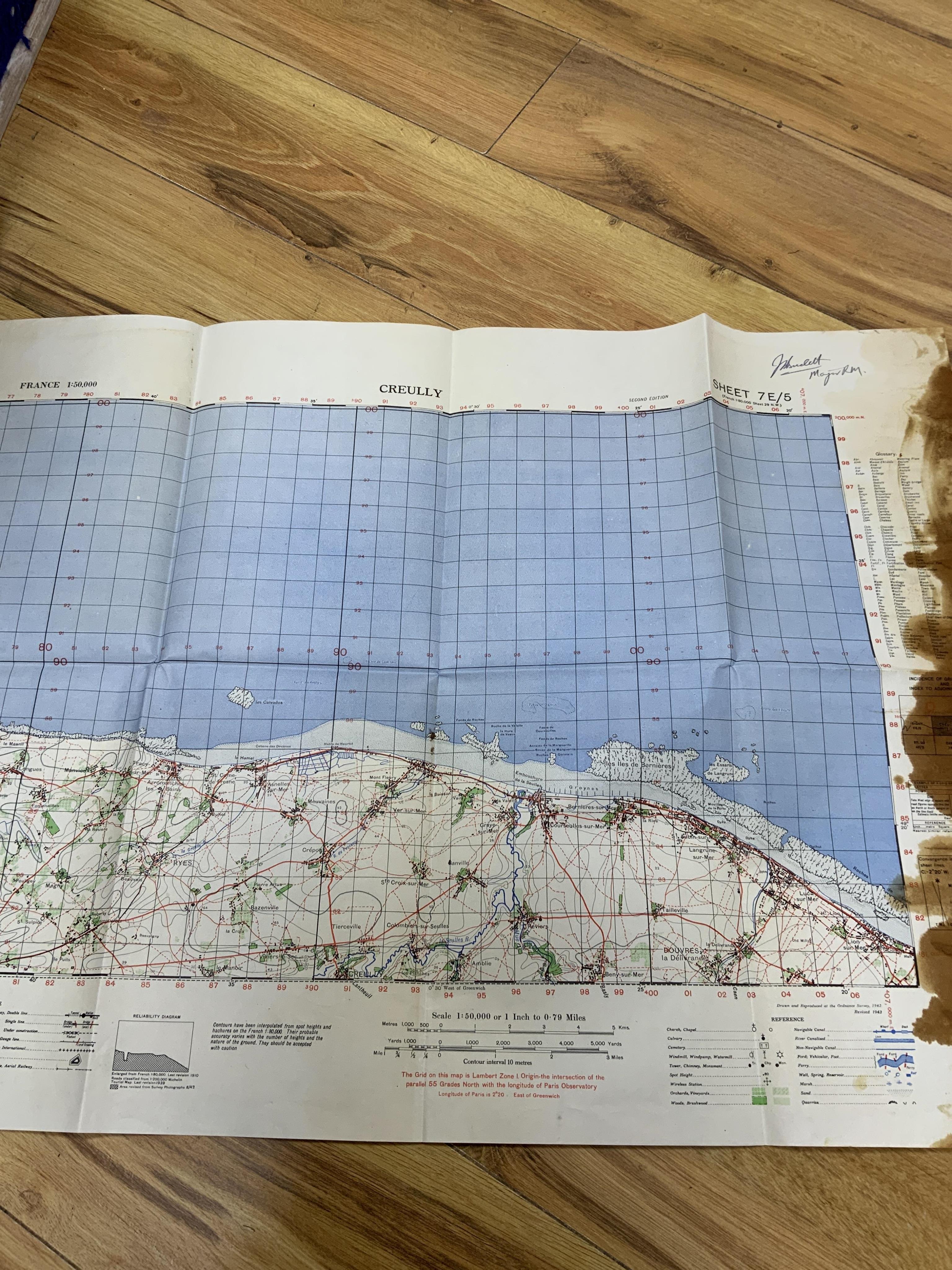 WWII D-Day and Operation Neptune related interest; an archive of mainly naval documents, maps and photographs relating to the invasion of Juno beach, 6 June 1944, comprising; the personal papers, maps, and other document